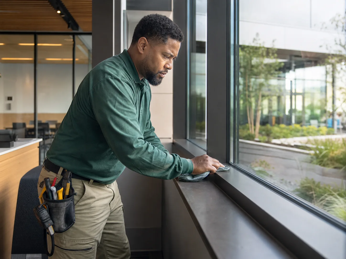 A facilities professional carrying out a careful inspection task